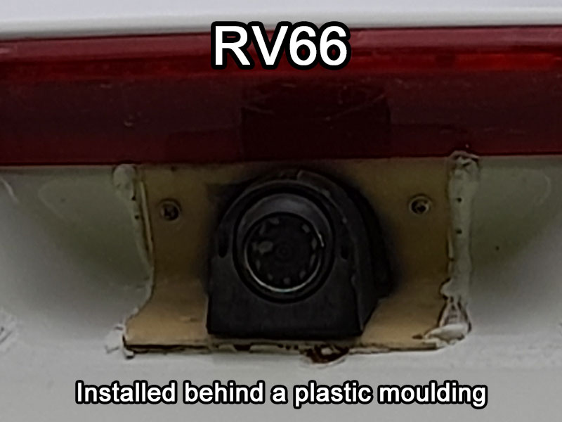 Black pod camera behind plastic moulding trim on a Swift Motorhome